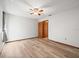 Bedroom featuring wood-look flooring, a ceiling fan, and natural light at 5443 Ott Ct, Spring Hill, FL 34608