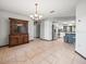 Dining area connecting to a modern kitchen, featuring stainless steel appliances and granite countertops at 5443 Ott Ct, Spring Hill, FL 34608