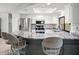 Modern kitchen featuring a breakfast bar with seating, stainless steel appliances, and granite countertops at 5443 Ott Ct, Spring Hill, FL 34608