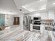 Kitchen featuring granite countertops, stainless steel appliances, and an island with barstool seating at 5443 Ott Ct, Spring Hill, FL 34608