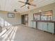Sun room with ceiling fans, built-in storage and view of the outdoors at 5443 Ott Ct, Spring Hill, FL 34608