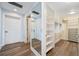 Walk-in closet with built-in shelving and a full-length mirror on the entry door at 555 5Th Ne Ave # 1243, St Petersburg, FL 33701