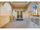 Condo entrance featuring white pillars, double doors, and tile floors at 555 5Th Ne Ave # 1243, St Petersburg, FL 33701