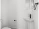 Modern powder room with a pedestal sink and sleek matte black fixtures against a white wall at 6213 64Th N Way, Pinellas Park, FL 33781