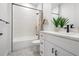 Stylish bathroom featuring modern fixtures, white tile, and a bathtub with shower at 6213 64Th N Way, Pinellas Park, FL 33781