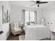 Cozy bedroom with neutral tones and a large window, creating a relaxing atmosphere at 6213 64Th N Way, Pinellas Park, FL 33781