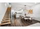 Open floorplan connecting the dining area and kitchen features unique lighting and modern decor at 6213 64Th N Way, Pinellas Park, FL 33781