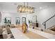Bright dining room featuring modern light fixture and a large dining table, perfect for Gathering gatherings at 6213 64Th N Way, Pinellas Park, FL 33781