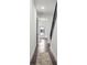 Hallway with hardwood floors, white walls, and access to the bedroom at 6213 64Th N Way, Pinellas Park, FL 33781