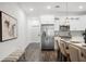 Modern kitchen design featuring stainless steel refrigerator, white cabinets, and wood floors at 6213 64Th N Way, Pinellas Park, FL 33781