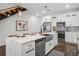 Bright open-concept kitchen featuring a large island, modern appliances, and sleek cabinetry at 6213 64Th N Way, Pinellas Park, FL 33781