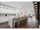 Open concept kitchen boasts a large island, stainless steel appliances, and white cabinets at 6213 64Th N Way, Pinellas Park, FL 33781