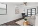 Living room with modern furnishings, hardwood floors, and large windows at 6213 64Th N Way, Pinellas Park, FL 33781