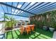 A rooftop patio provides an outdoor dining space, a pergola, and scenic views at 6213 64Th N Way, Pinellas Park, FL 33781