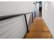 Staircase with wooden stairs and a wire railing at 6213 64Th N Way, Pinellas Park, FL 33781