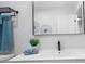 Bathroom vanity featuring double mirrors, sleek fixtures, and an accent plant at 6291 63Rd N St, Pinellas Park, FL 33781