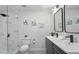 Bathroom showcasing double sinks, sleek fixtures, a glass-enclosed shower, and modern decor at 6291 63Rd N St, Pinellas Park, FL 33781