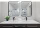 Bathroom featuring a double sink vanity, modern fixtures, and framed mirrors at 6291 63Rd N St, Pinellas Park, FL 33781