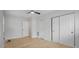 Bedroom featuring light walls and floors and multiple closets at 6291 63Rd N St, Pinellas Park, FL 33781
