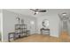 Bright entryway with hardwood floors, modern decor, and a round mirror at 6291 63Rd N St, Pinellas Park, FL 33781