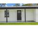 Close-up of the front door with a decorative window and the house number clearly displayed at 6291 63Rd N St, Pinellas Park, FL 33781