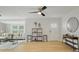 Airy living room featuring hardwood floors, modern decor, and a stylish ceiling fan at 6291 63Rd N St, Pinellas Park, FL 33781