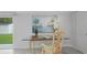 Bright office nook with desk, chair, and view of backyard through sliding glass doors at 6291 63Rd N St, Pinellas Park, FL 33781