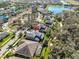 An aerial view showcases the home's in-ground pool and a well-maintained lawn and landscaping at 6640 Park Strand Dr, Apollo Beach, FL 33572