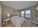 Bright bedroom featuring a comfortable bed and two windows providing natural light at 6640 Park Strand Dr, Apollo Beach, FL 33572