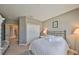 Bedroom with a plush bed, closet, and an open doorway leading to another room at 6640 Park Strand Dr, Apollo Beach, FL 33572