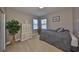Cozy bedroom with natural light, a wardrobe, and a comfortable bed in neutral tones at 6640 Park Strand Dr, Apollo Beach, FL 33572