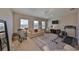 Spacious bonus room with a sofa, rug, treadmill, and ample natural light at 6640 Park Strand Dr, Apollo Beach, FL 33572