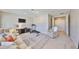 Expansive bonus room featuring a treadmill, sofa, entertainment center, and neutral tones at 6640 Park Strand Dr, Apollo Beach, FL 33572