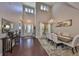 Elegant dining room with chandelier and views of the front entry way at 6640 Park Strand Dr, Apollo Beach, FL 33572