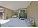 Inviting front porch with sitting bench and hanging swing at 6640 Park Strand Dr, Apollo Beach, FL 33572