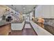 Gourmet kitchen features a center island, stainless appliances, granite counters, and hardwood floors at 6640 Park Strand Dr, Apollo Beach, FL 33572