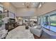 Bright open floor plan with high ceilings, hardwood floors, and an open layout leading to the lanai at 6640 Park Strand Dr, Apollo Beach, FL 33572