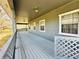 Grey painted, covered back porch at 7705 W Four Pines Rd, Plant City, FL 33565