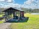 An open-sided shed or barn structure on the property at 7705 W Four Pines Rd, Plant City, FL 33565