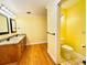 Bathroom features a granite countertop and a toilet in a separate space at 7705 W Four Pines Rd, Plant City, FL 33565