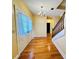 Spacious foyer with hardwood floors and elegant staircase, creating a grand entrance at 7705 W Four Pines Rd, Plant City, FL 33565