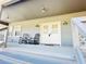 Inviting covered porch with rocking chairs, perfect for relaxing and enjoying the outdoors at 7705 W Four Pines Rd, Plant City, FL 33565