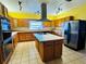 Spacious kitchen with a center island, stainless steel appliances, and plenty of counter space at 7705 W Four Pines Rd, Plant City, FL 33565
