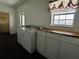 Laundry room includes a washer and dryer at 7705 W Four Pines Rd, Plant City, FL 33565