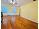 Bright, spacious room with hardwood floors, natural light and plenty of space at 7705 W Four Pines Rd, Plant City, FL 33565