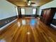 Large living room boasts hardwood floors, a wooden ceiling, and ample windows for natural light at 7705 W Four Pines Rd, Plant City, FL 33565