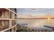 Scenic view of a beachfront condo with a private beach and clear ocean views at sunset at 805 S Gulfview Blvd # 305B, Clearwater, FL 33767