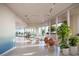 Bright gym with modern equipment and a serene view of the ocean and lush greenery at 805 S Gulfview Blvd # 305B, Clearwater, FL 33767