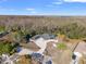 Stunning aerial perspective of the house highlighting its solar panels, large lot and pristine setting at 9911 Mendel Dr, New Port Richey, FL 34654