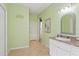 Bathroom area with sink, mirror and doorway to an adjacent room at 9911 Mendel Dr, New Port Richey, FL 34654